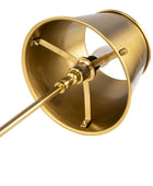 Close-up of a brass wall sconce showing the interior of the shade, mounting brackets, and part of the metal stem against a white background.