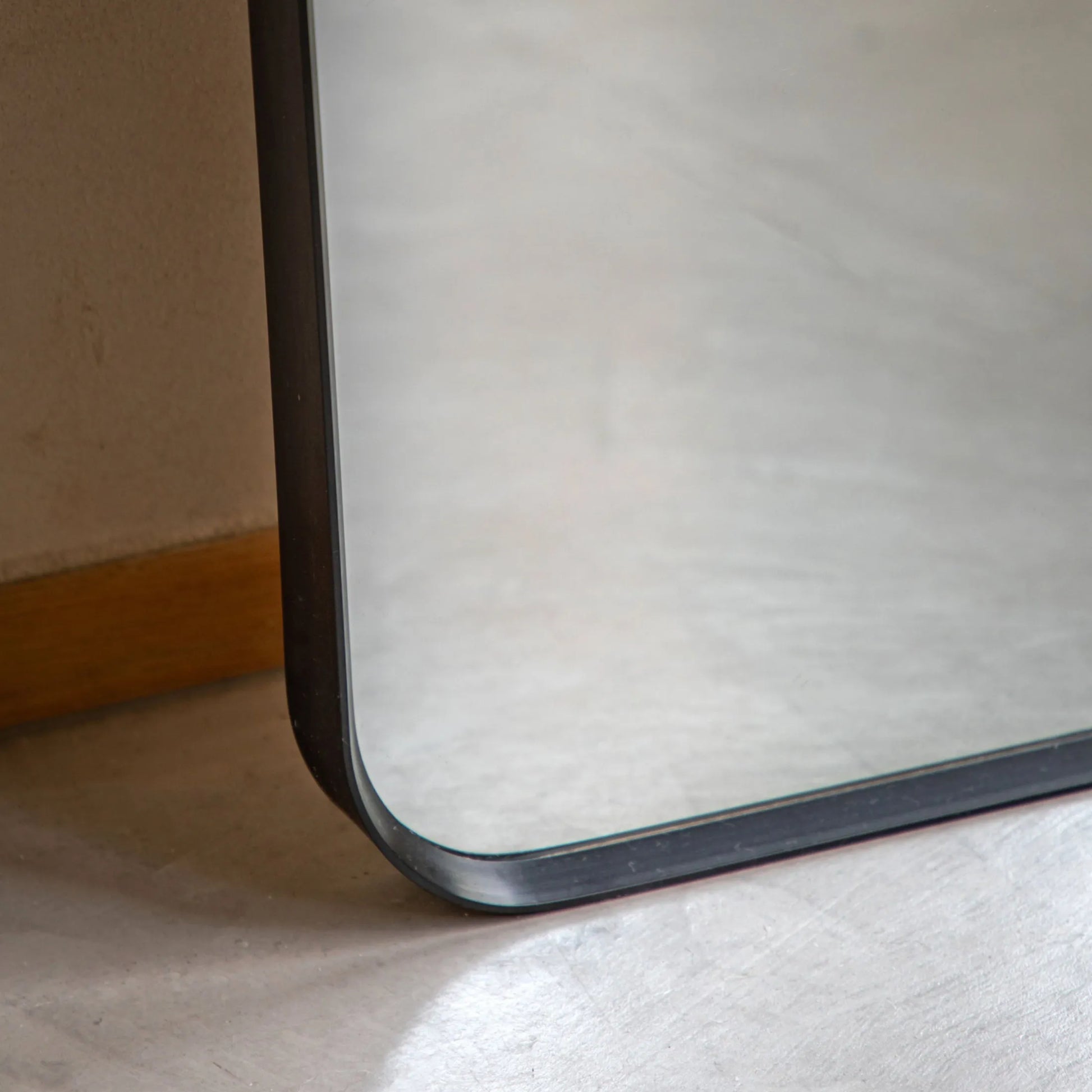 Slim Black Frame Curved Top Leaner Mirror