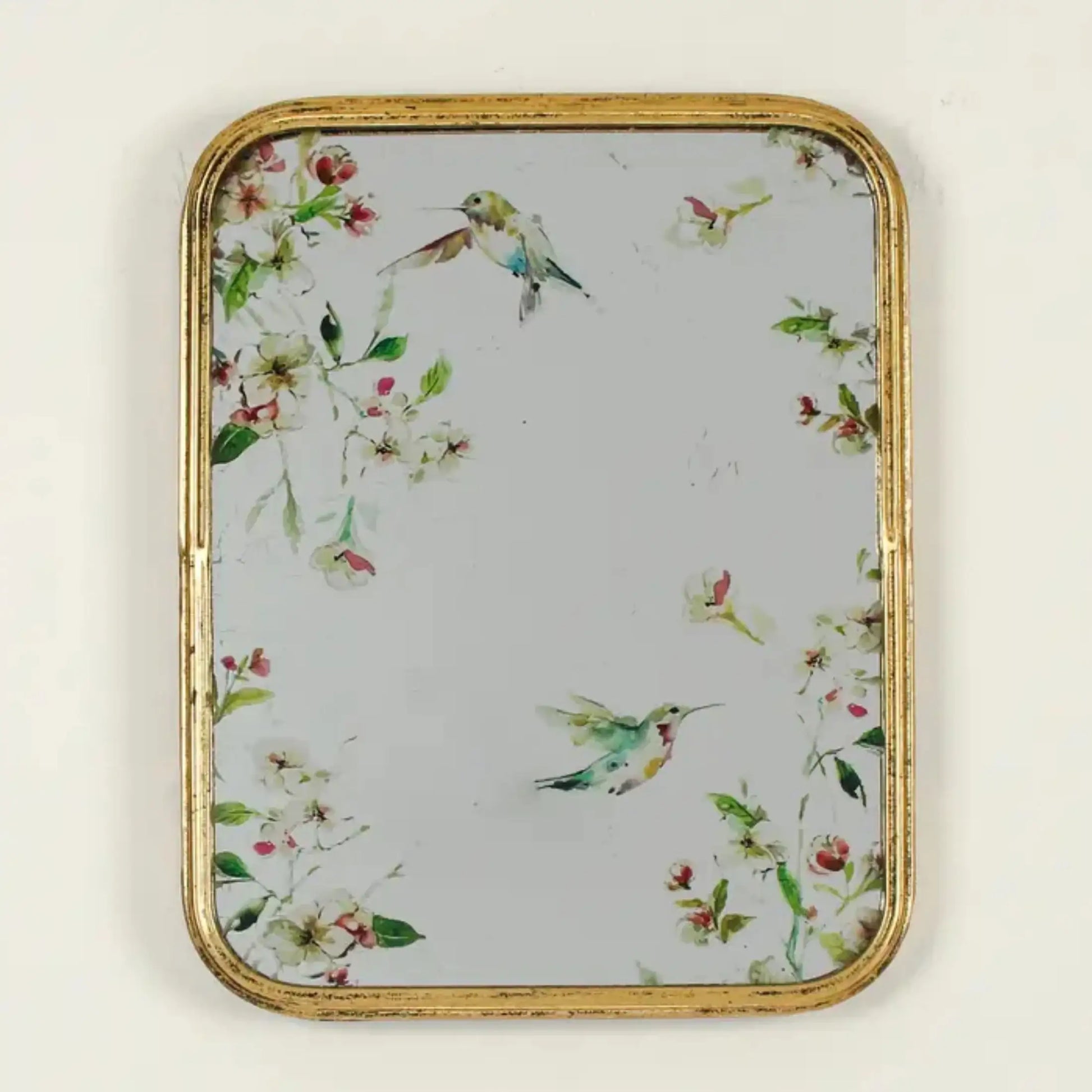 Decorative tray with floral and hummingbird pattern on a light background