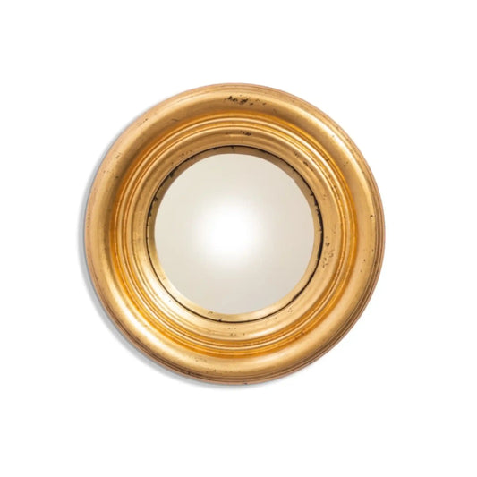 Round gold-framed mirror on a white background