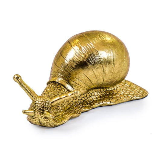 Gold snail sculpture on a white background