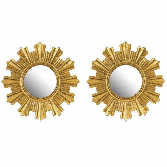 Two gold sunburst mirrors on a white background