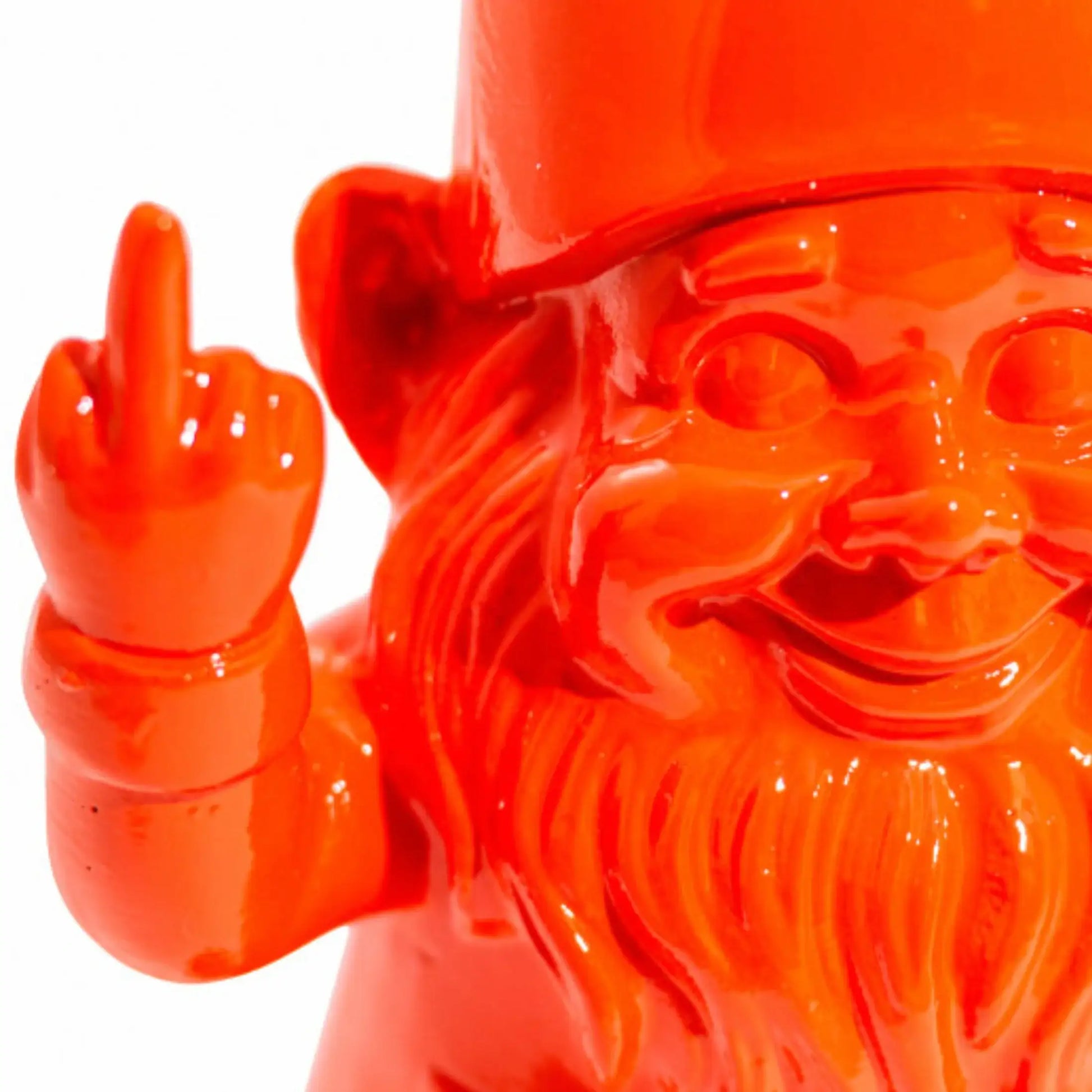 Orange gnome figurine making a middle finger gesture on a white background