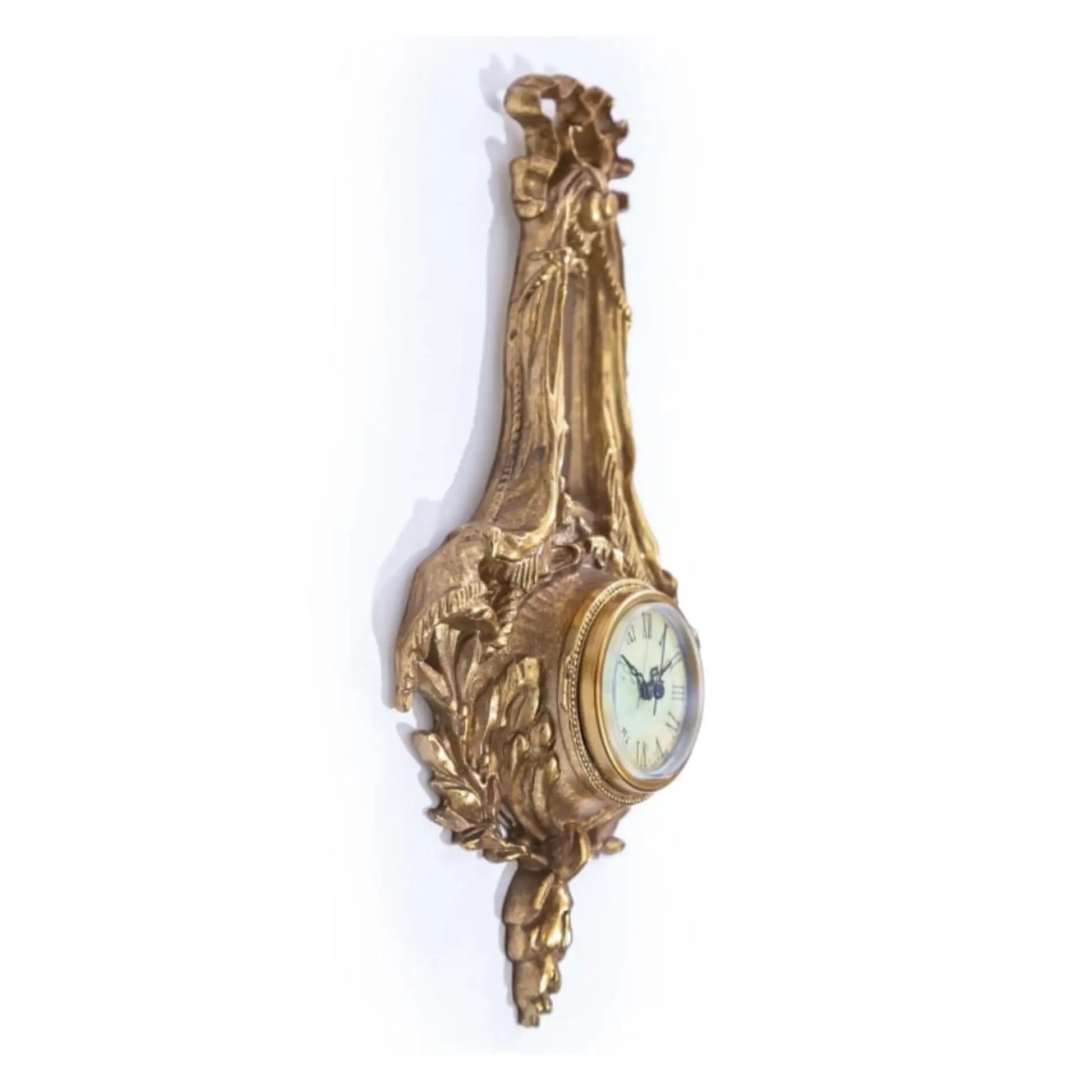 Decorative gold wall clock on a white background