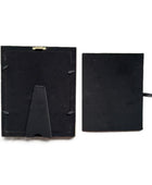 Black picture frame backplate shown in two pieces on a white background, one piece featuring a built-in display stand and the other a small side tab.