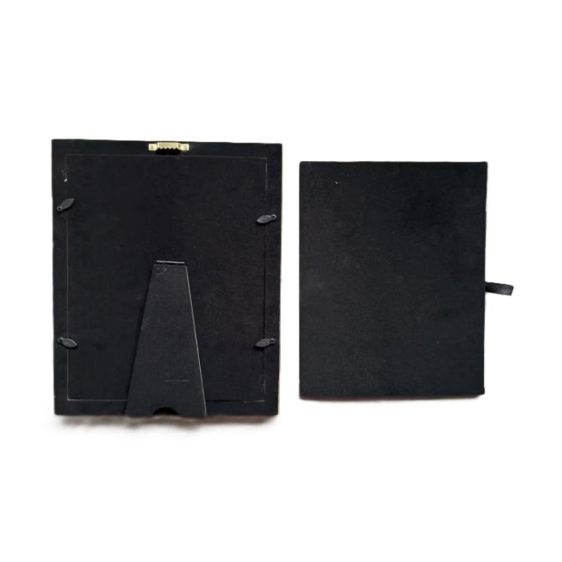 Black picture frame backplate shown in two pieces on a white background, one piece featuring a built-in display stand and the other a small side tab.