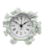 Decorative wall clock with butterfly designs on a white background