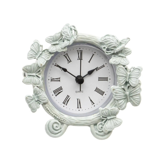 Decorative wall clock with butterfly designs on a white background