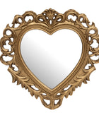 An ornate heart-shaped wall mirror with a detailed, carved gold frame on a plain white background.