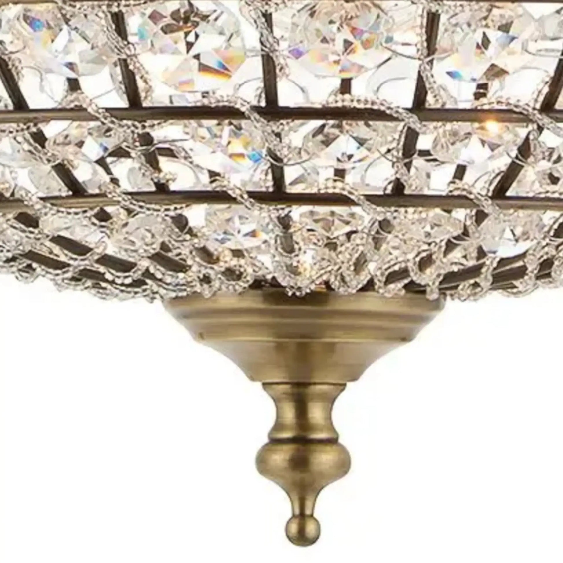 Close-up of a decorative chandelier with crystal accents on a white background