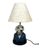 Dog-shaped lamp with a white shade on a white background