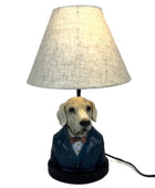 Dog-shaped lamp with a white shade on a white background