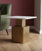 Small table with marble top and bronze base on a gray carpet