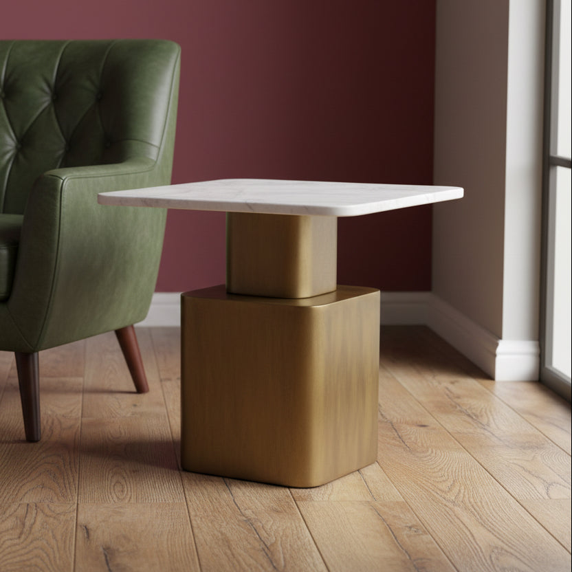 Small table with marble top and bronze base on a gray carpet