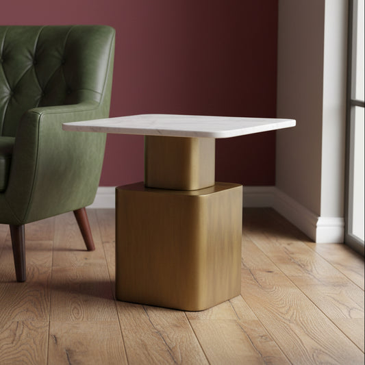 Small table with marble top and bronze base on a gray carpet