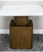 Small table with marble top and bronze base on a gray carpet