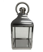 Silver lantern with a clear glass front on a white background