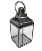 Silver lantern with a clear glass design on a white background