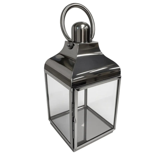 Silver lantern with a clear glass design on a white background