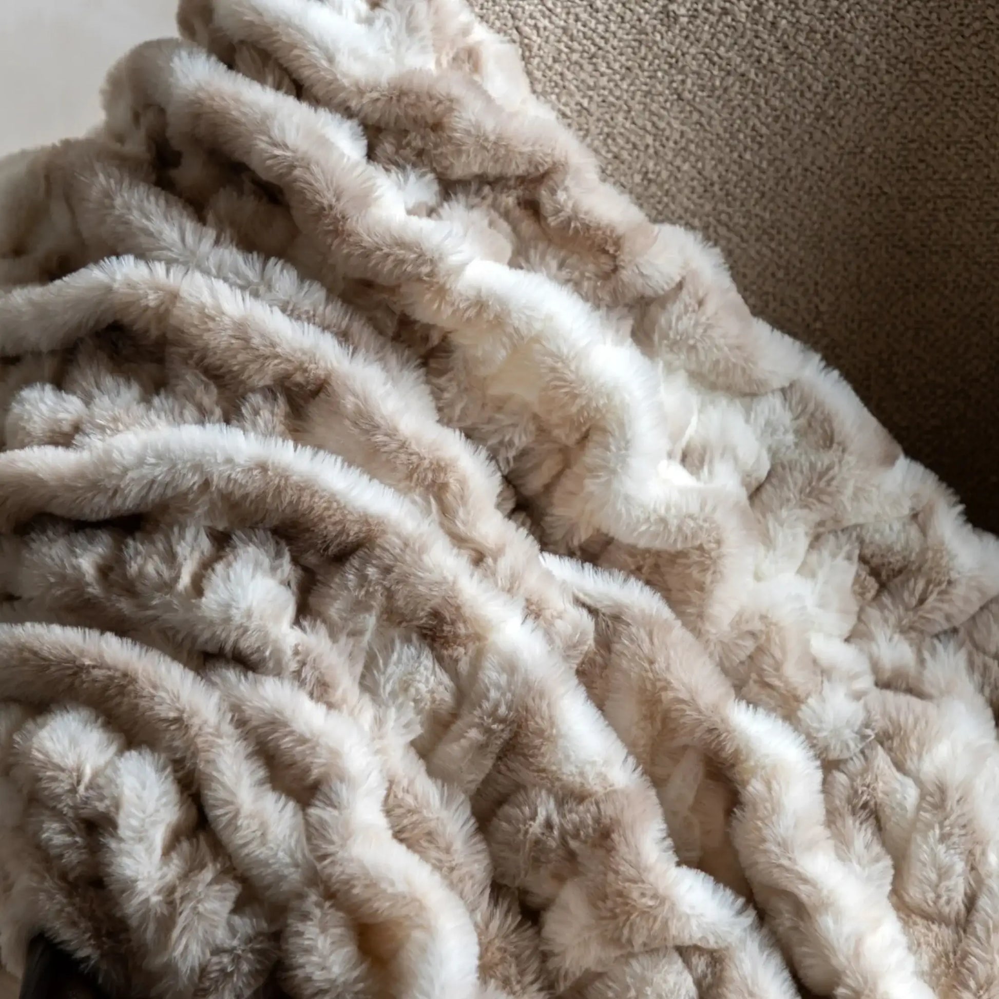 Close-up of a beige textured blanket
