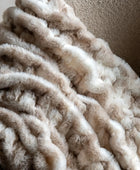 Close-up of a beige textured blanket