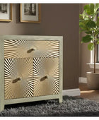 Decorative cabinet with sunburst pattern in a room with a plant and books.