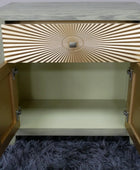 Wooden cabinet with open doors on a textured surface