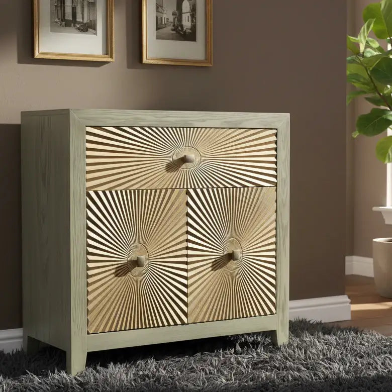 Wooden cabinet with gold sunburst design on doors in a room setting.