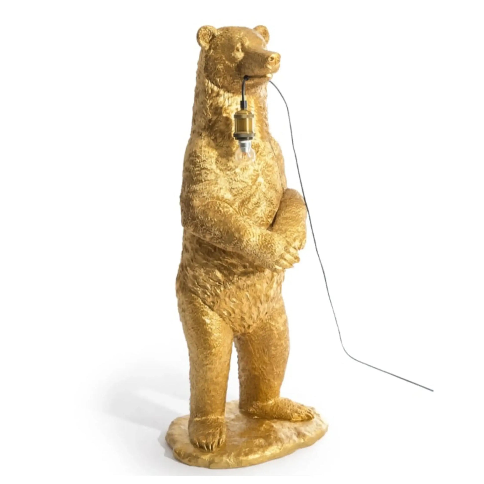 Gold bear-shaped lamp with a light bulb on a white background