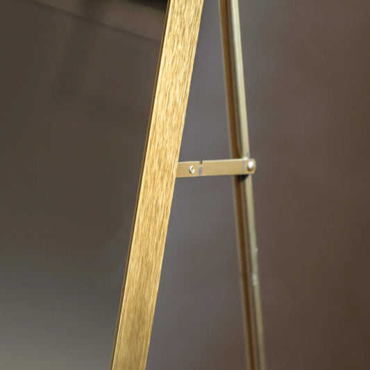Wooden easel against a dark background