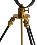 Vintage-style tripod lamp with brass and black design on a white background