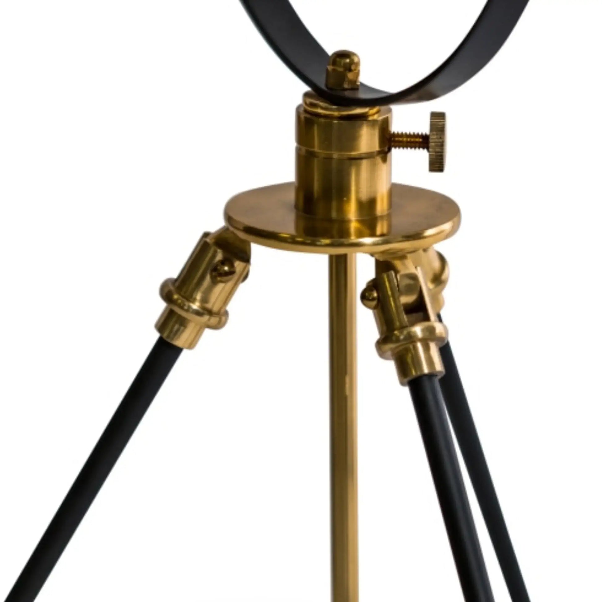 Vintage-style tripod lamp with brass and black design on a white background
