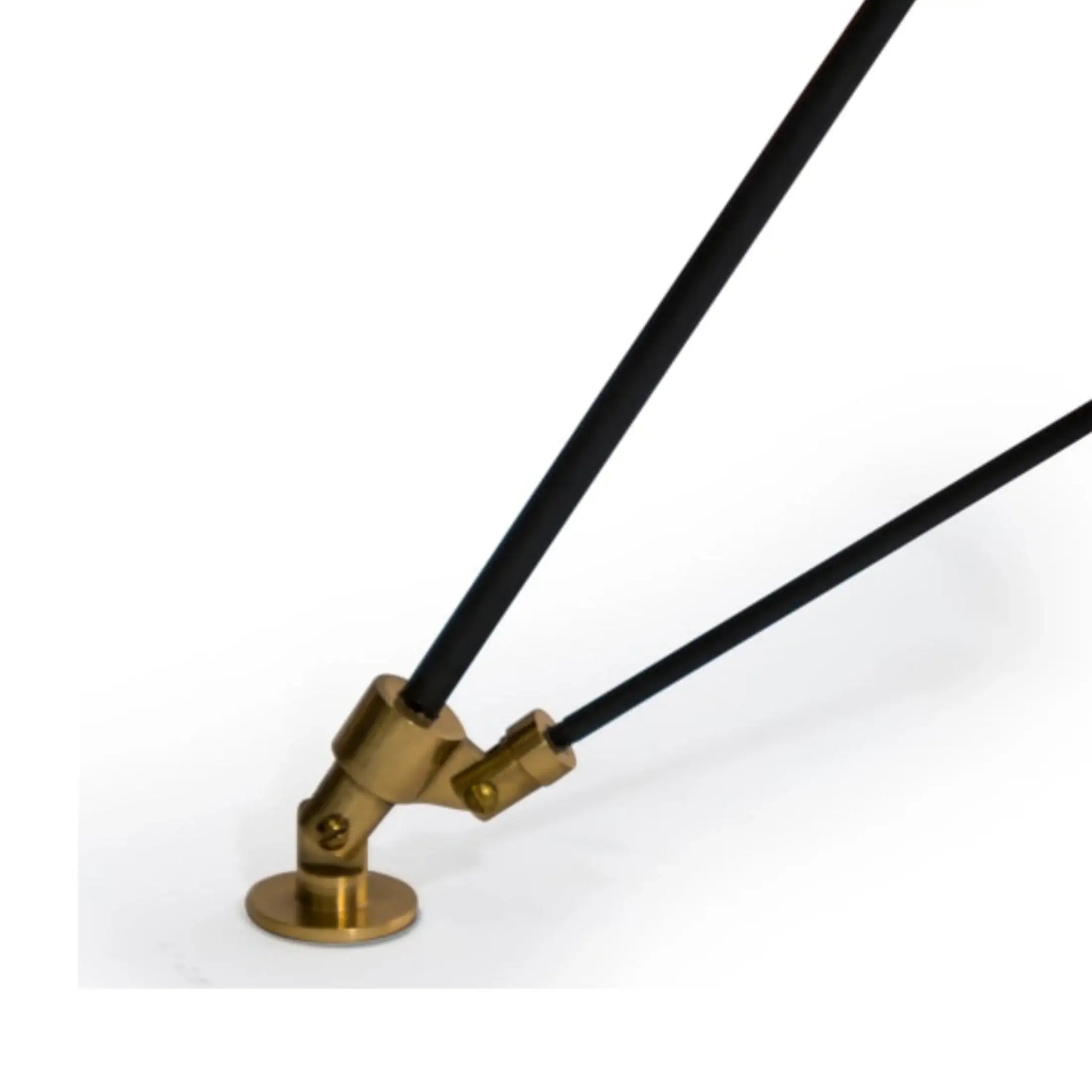 Brass lamp arm with black cable on a white background
