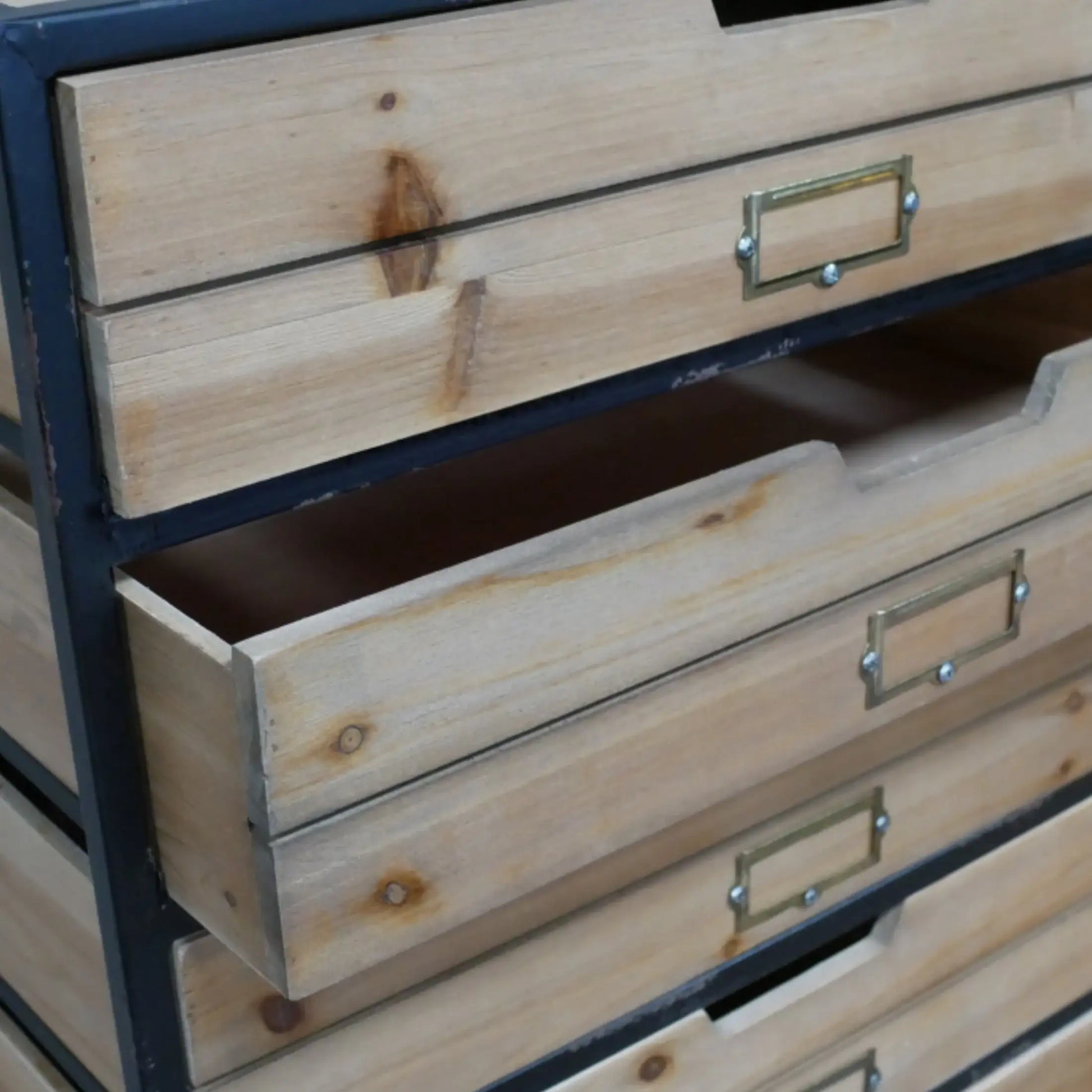 Wooden drawers with metal handles on a wooden cabinet