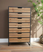 Tall wooden dresser with metal frame against a gray wall with decorative elements.