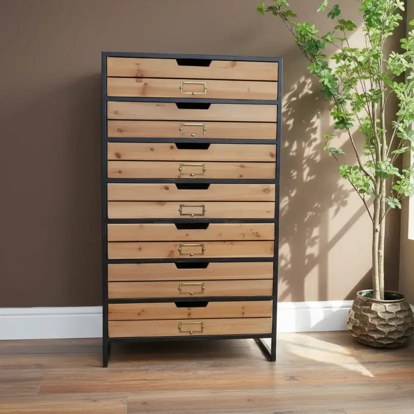 Tall wooden dresser with metal frame against a gray wall with decorative elements.