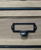 Wooden drawer with a black metal handle