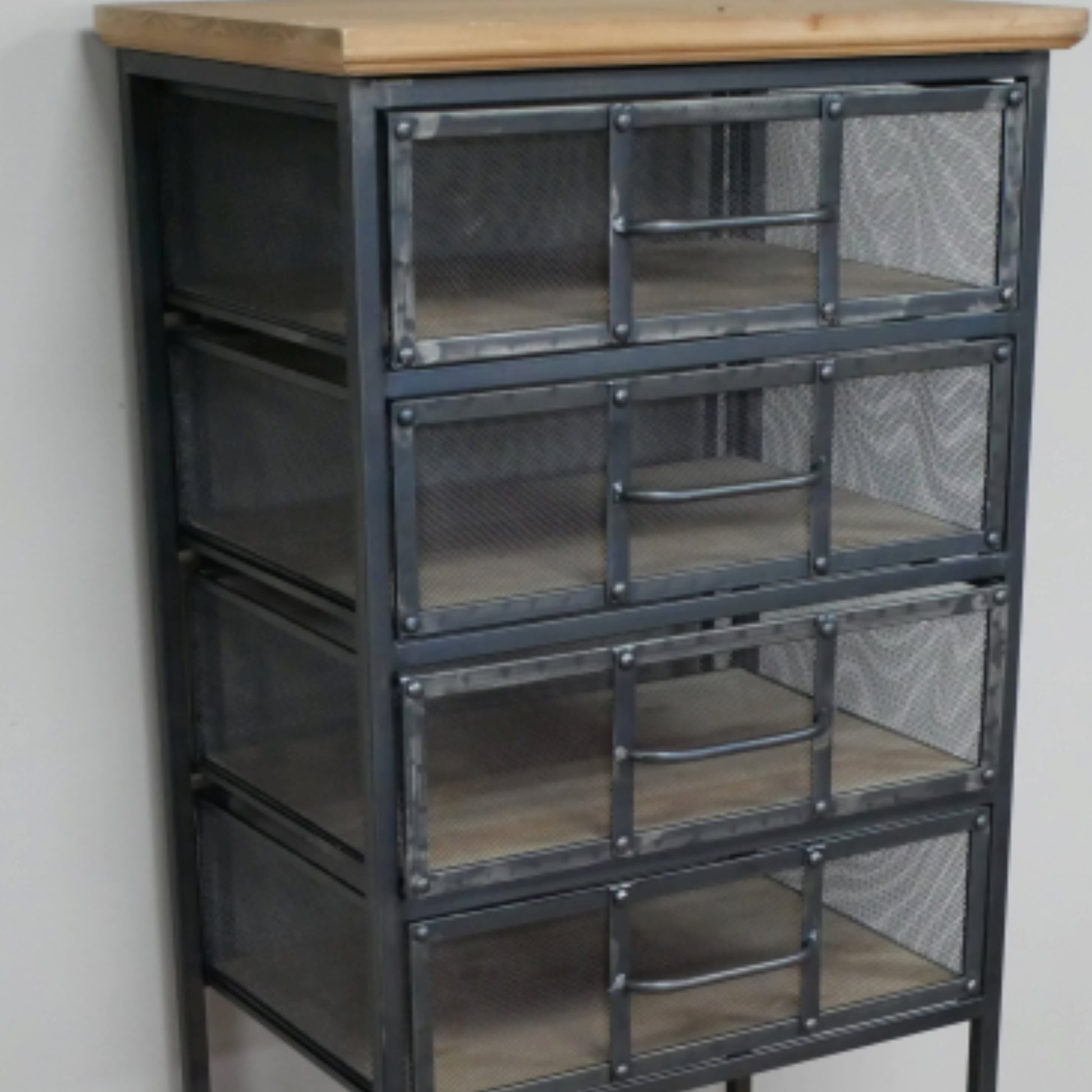 Metal cabinet with glass panels and wooden top against a neutral wall