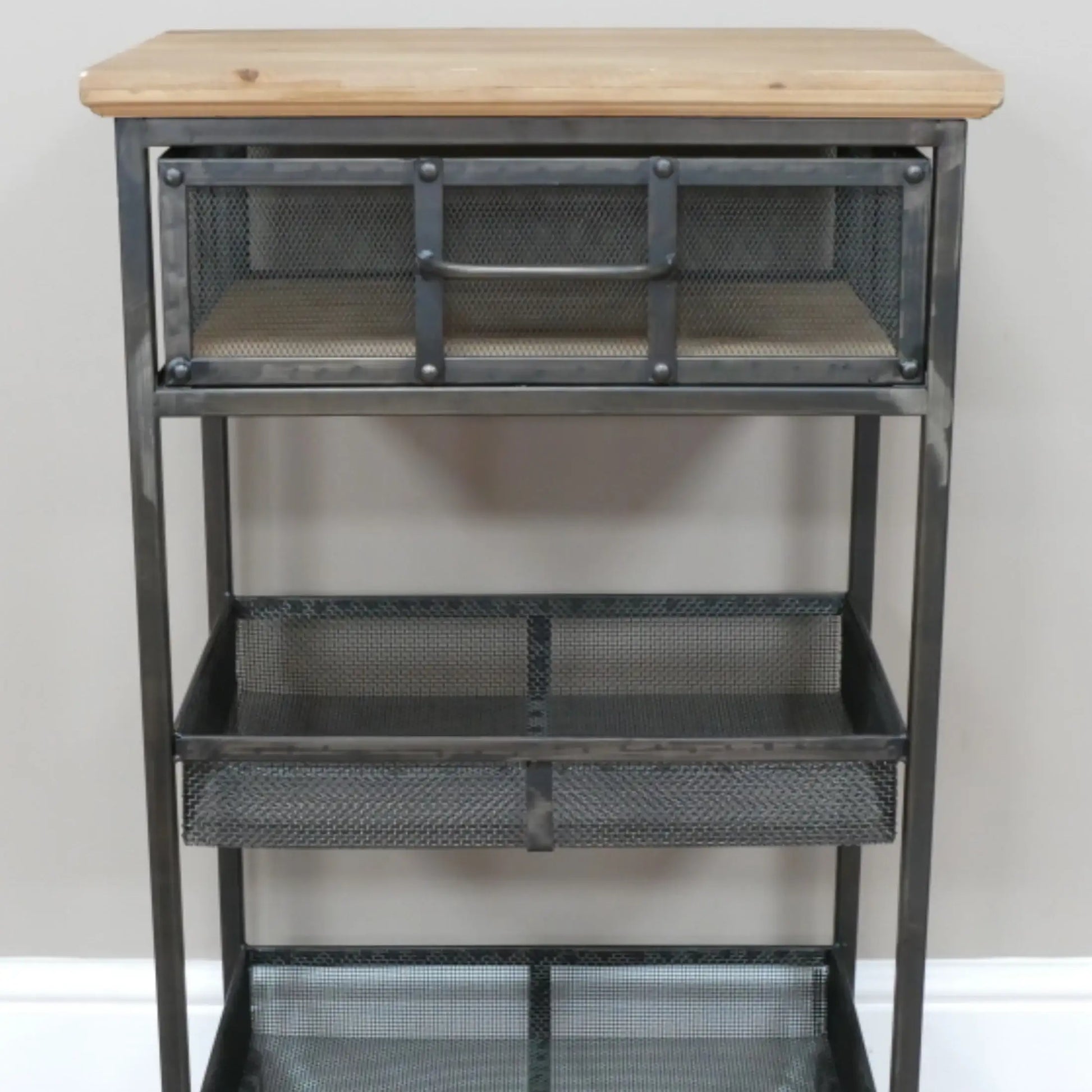 Metal shelving unit with wooden top against a white wall