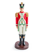 Figurine of a soldier in a red and white uniform on a white background
