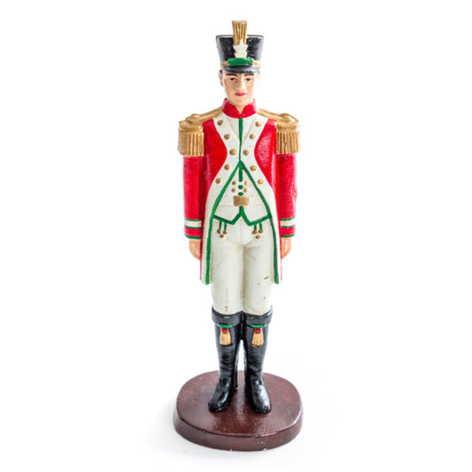 Figurine of a soldier in a red and white uniform on a white background