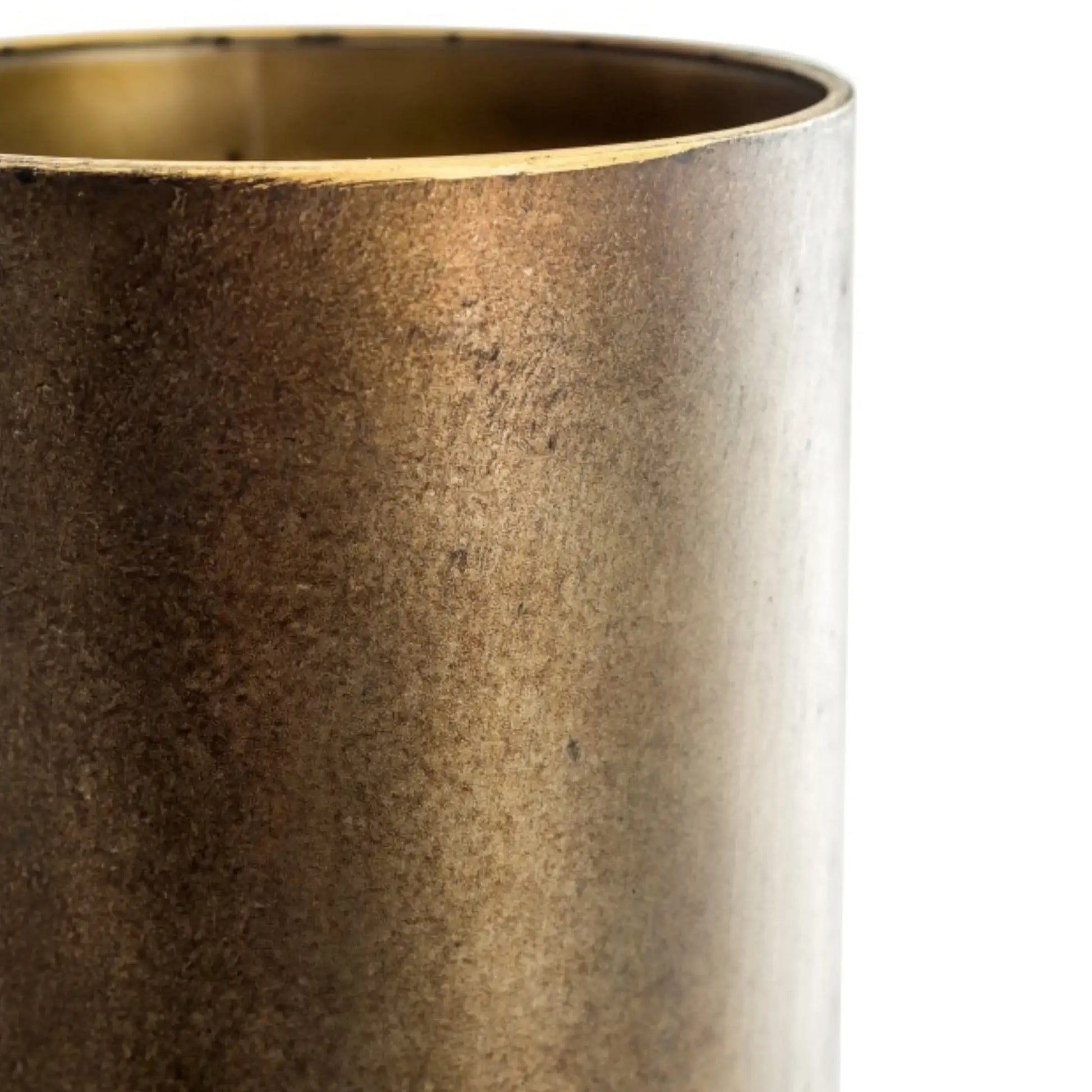 Close-up of a textured bronze vase on a white background