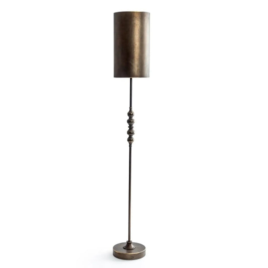 Bronze floor lamp with a cylindrical shade on a white background