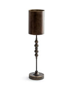 Bronze-colored floor lamp with a cylindrical shade on a white background