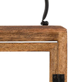 Close-up of a wooden table corner with metal brackets on a white background