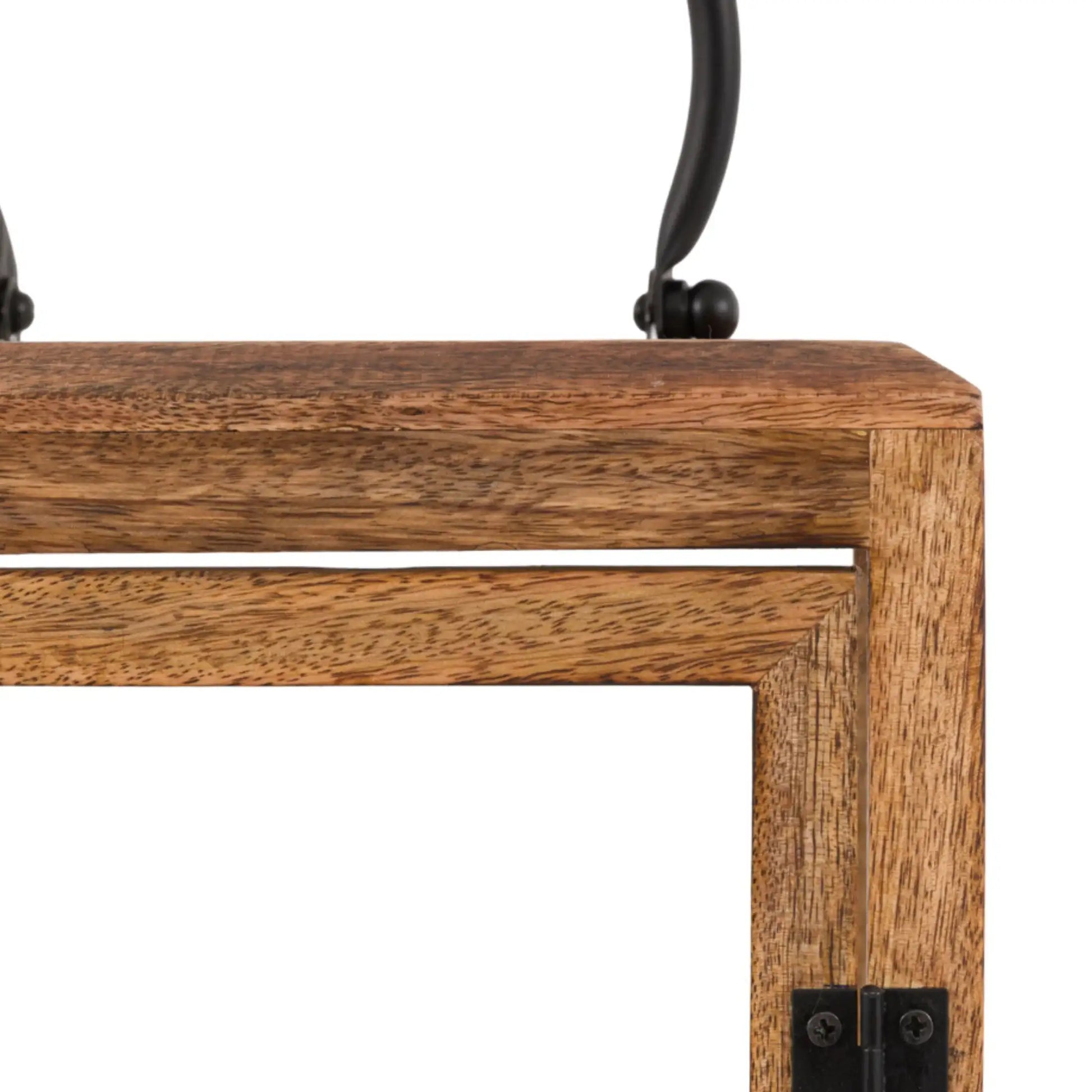 Close-up of a wooden table corner with metal brackets on a white background