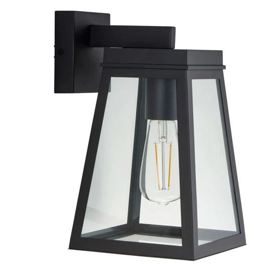 Black outdoor wall light fixture with clear glass shade on a white background