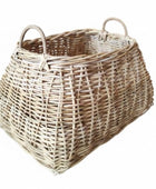 Wicker basket with handles on a white background