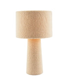 Beige textured table lamp on a white background