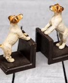 Dog-shaped bookends on a light gray background